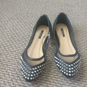 Black spiked flats